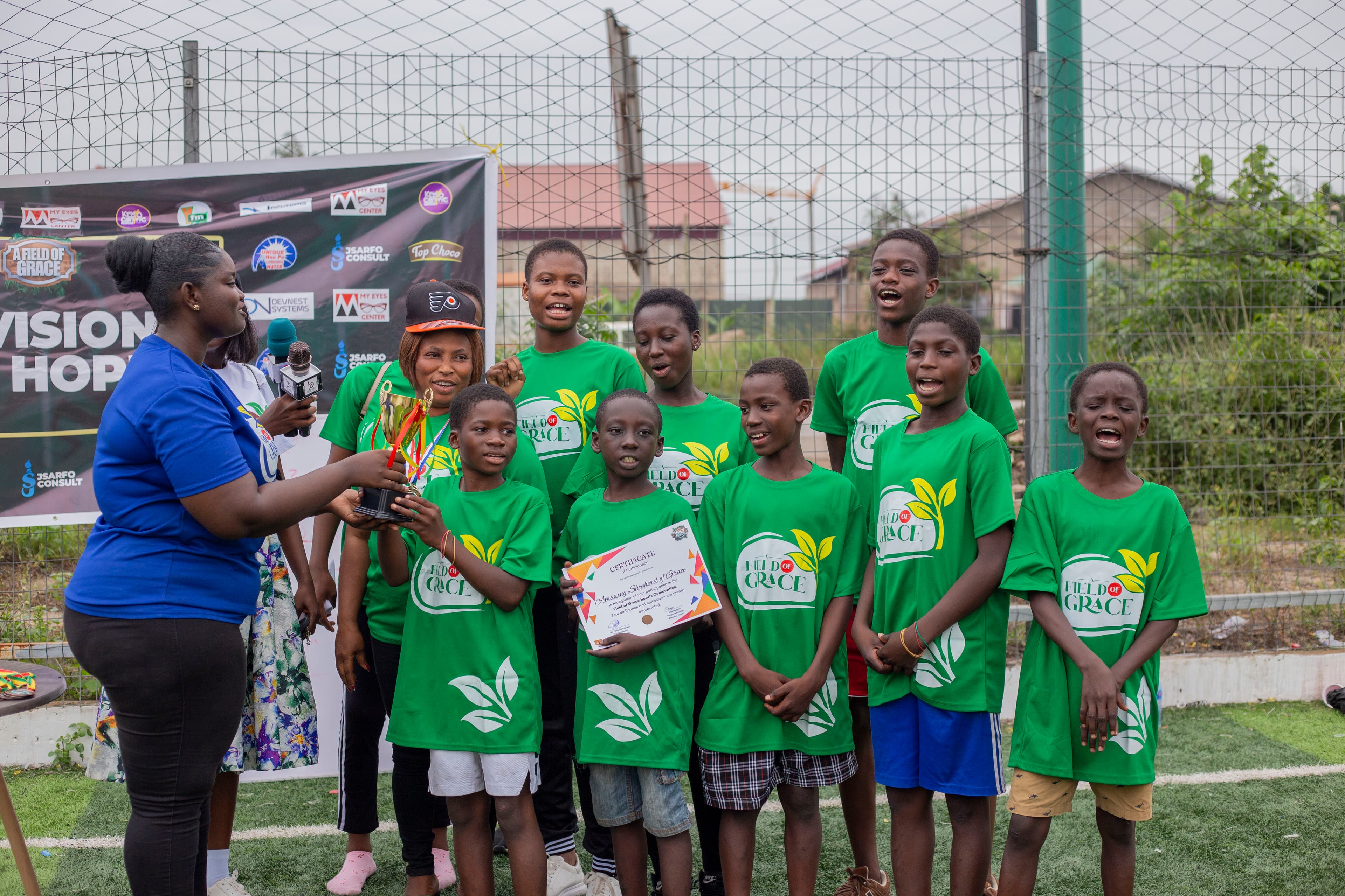 A team receiving a trophy and certificate